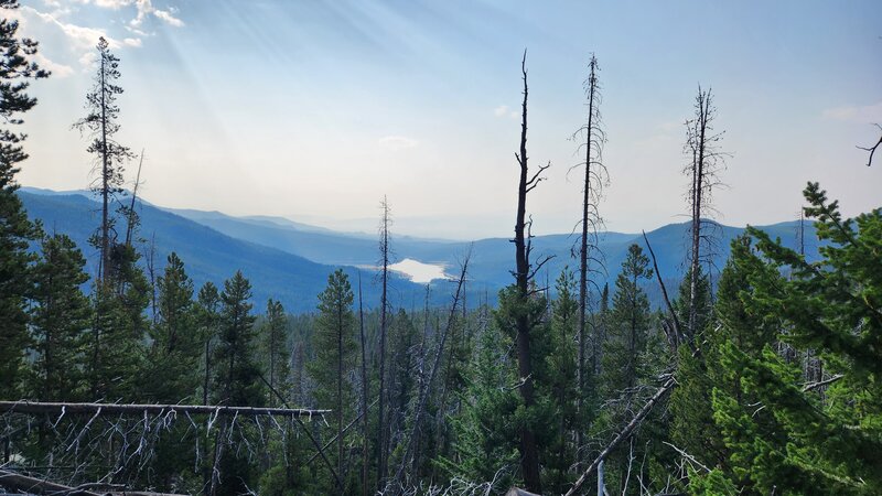 Lake Delmoe can be seen in the distance looking Southeast from the Fairy Trail. It is possible to ride down to it via steep sandy doubletrack.