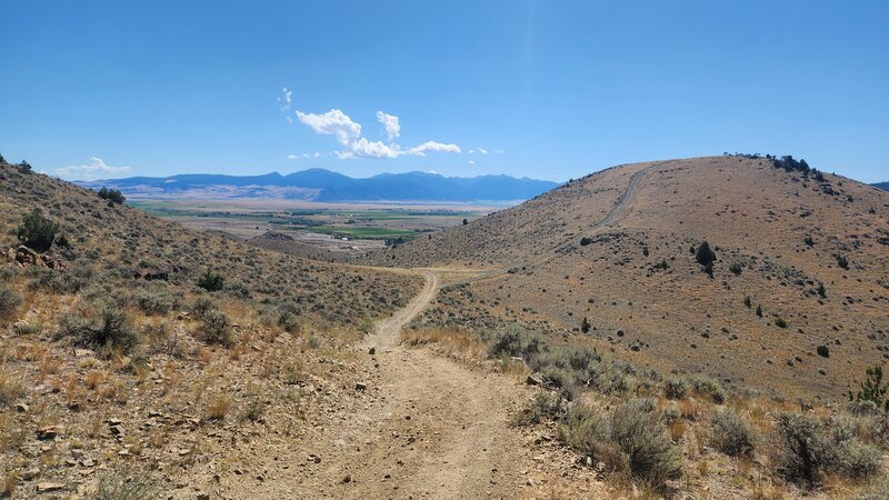 Photo taken from the apex of the BLM #16 trail. Their is a steep side trail up to a viewpoint on the right hand side, and the Tobacco Root Mountains are seen in the background.