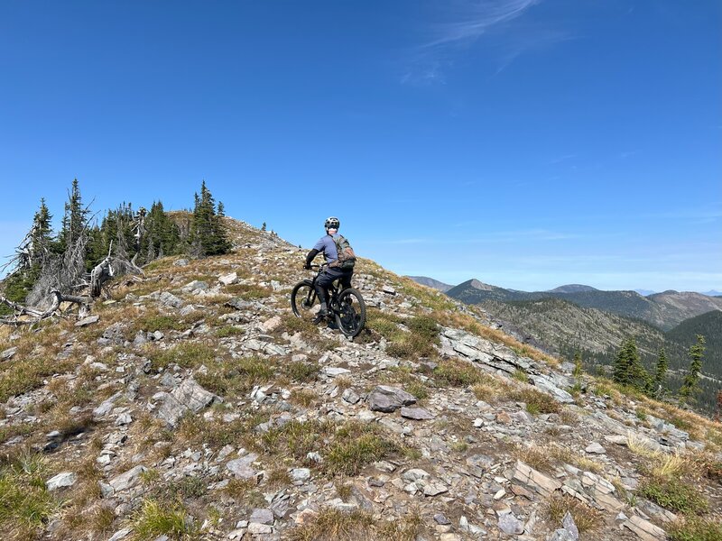 There are many sections on top of the ridges where there really is no visible trail. Follow the cairns as best you can and when in doubt, stay high!