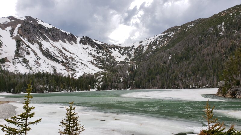 Bell Lake in early June is dwarfed by 10,000ft high mountains.