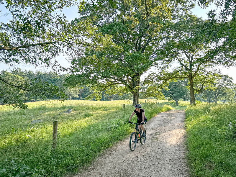 Riding through The Great Pasture, this portion is also part of the Bay Circuit Trail.