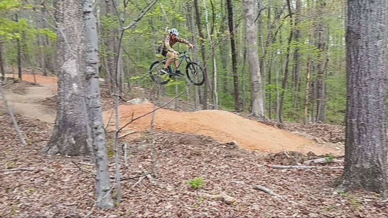 Mountain biker performing a jump.