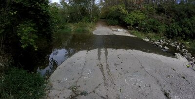 Crossing the creek over the spillway.