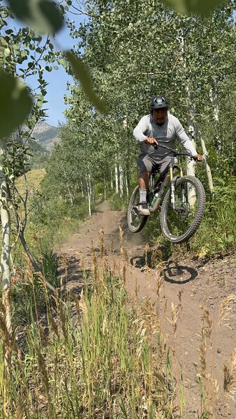 Catching air on lower Grin.