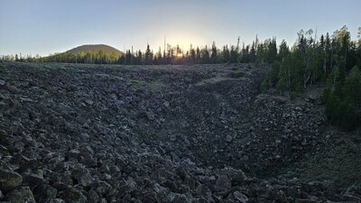 Big hole in the ground near the Marathon Trail. Hancock Peak in the back.