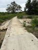 Creek crossing on paved bridge.