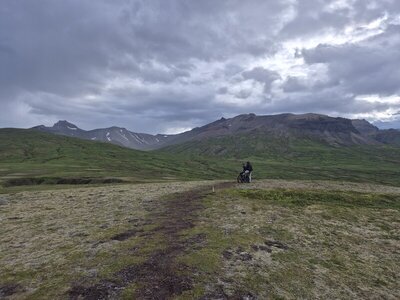 Two riders taking a short break after the last downhill toward the road.