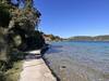 The small paved coastline beside the bay "Uvala Dumici".