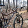 My bike stares wistfully down the trail, dreaming of sweeping berms and catching air with reckless abandon.
