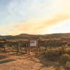 The Barracks Lane Trailhead with smoke from area forest fires casting an eerie light.