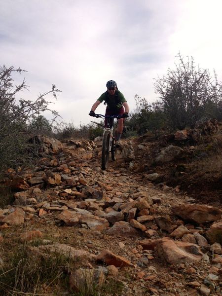 Ryan shredding some some rocky terrain at Red Hills