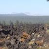 Smokey view of the Cascades, with lava flow.