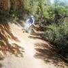 My friend rounding a corner on his first mountain bike ride