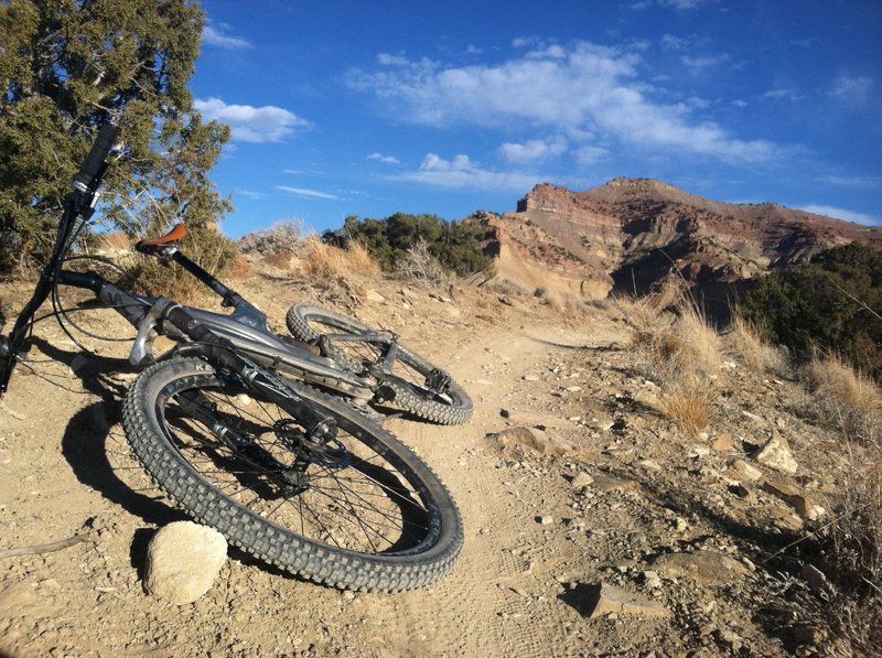 My old bike on Zippity Do Da with the colorful mountains in the background.